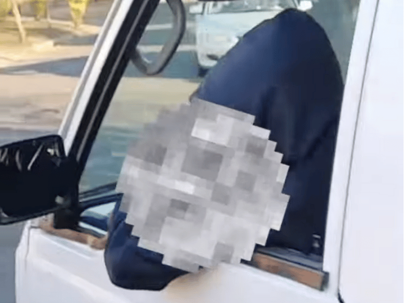 YOUNG LEARNER WITH BLURRED FACE DRIVING TAXI