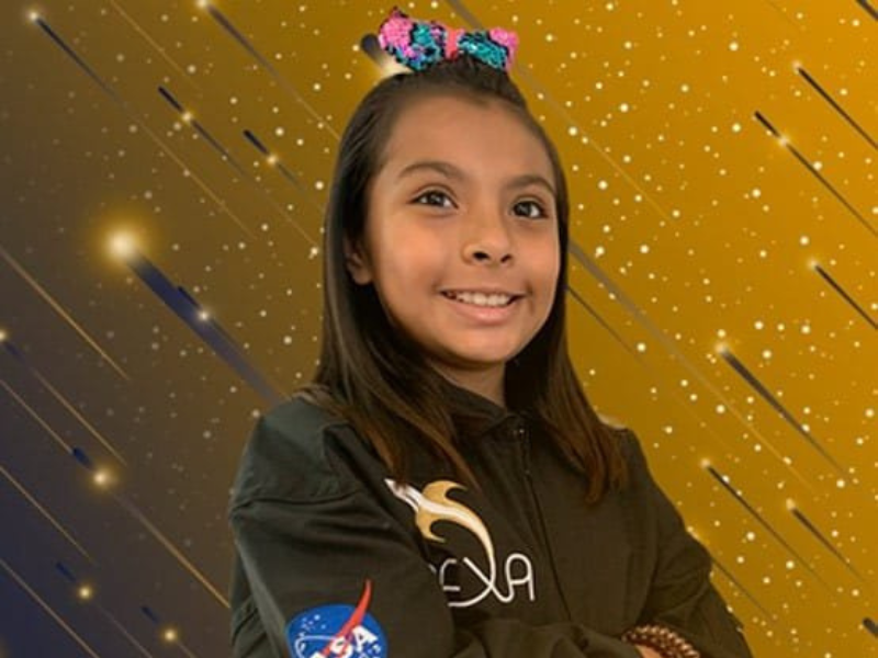 Young girl wearing a NASA suit