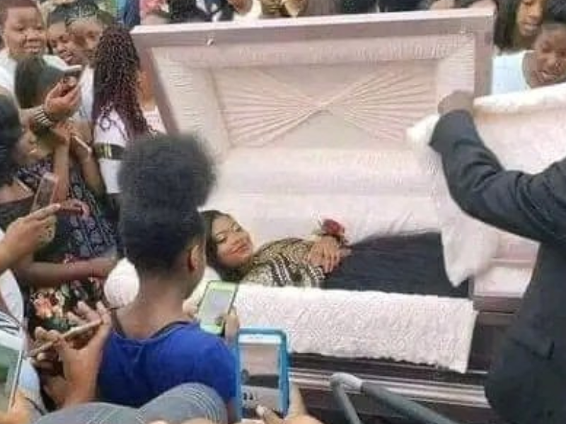 Young woman arriving to her prom inside a coffin