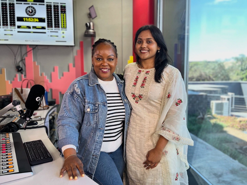 Yovani Naidoo stands with Carol Ofori at the East Coast Radio studios