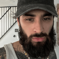 Zayn Malik with a full beard and moustache