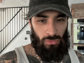 Zayn Malik with a full beard and moustache