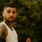 Zayn Malik wearing a white sleeveless top