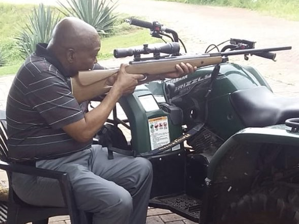 Zuma holding gun