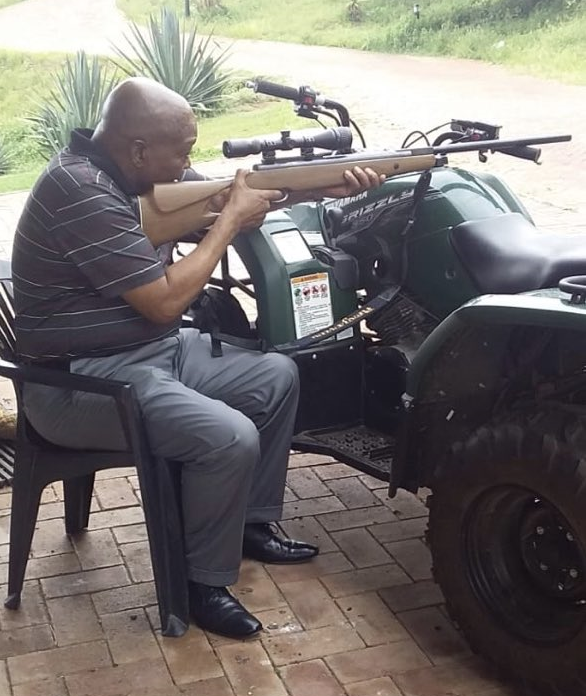 Zuma holding gun