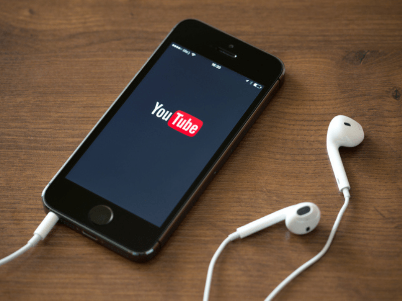 Apple iPhone 5S with YouTube logo on the screen