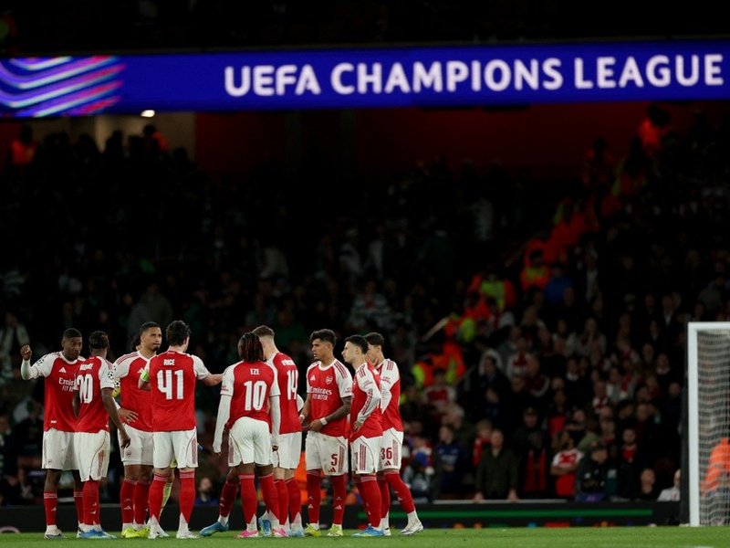 Arsenal players celebrate a goal in Champions League