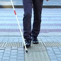 blind man walking on street edited