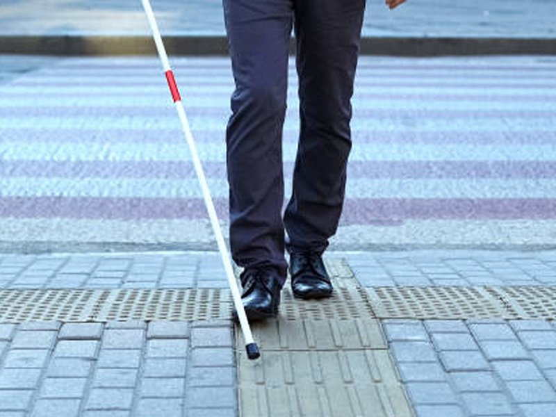 blind man walking on street edited
