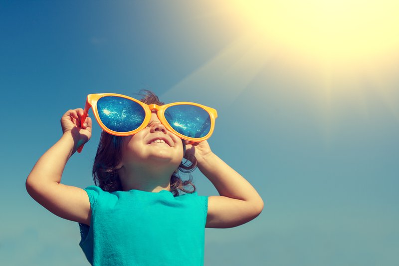 Child playing in the sun