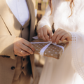 bride and groom opening a wedding gift.png
