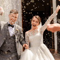 bride and groom sprinkled with rice