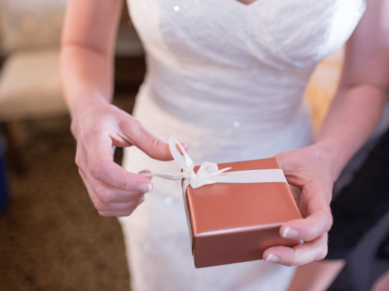 Bride opening a wedding gift