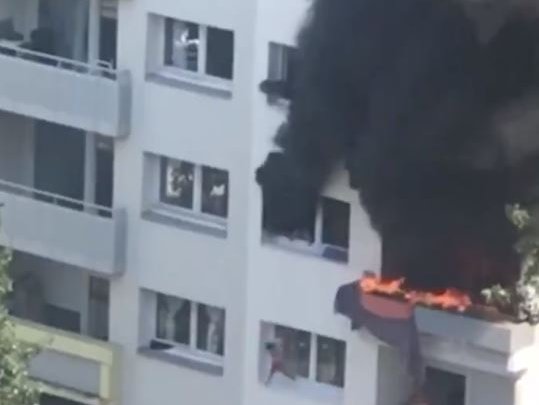 boys jumping out of burning building