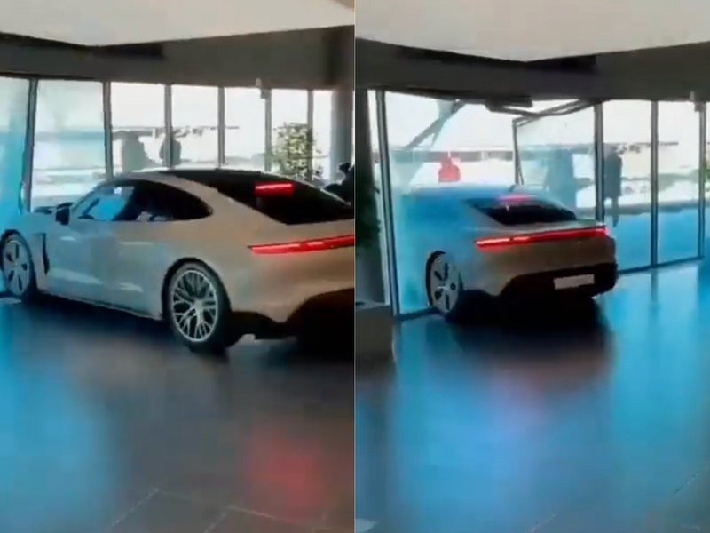 Porsche crashes through glass walls