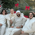 Celine Dion and her sons sitting on an outdoor couch