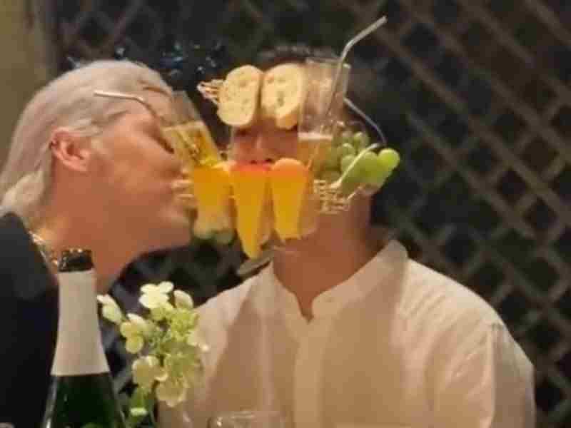 Guests eat cheese out of man's mouth