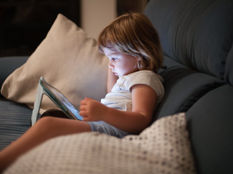 Child holding a tablet