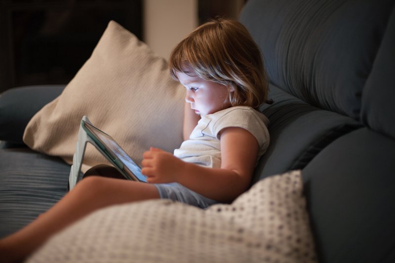 Child holding a tablet