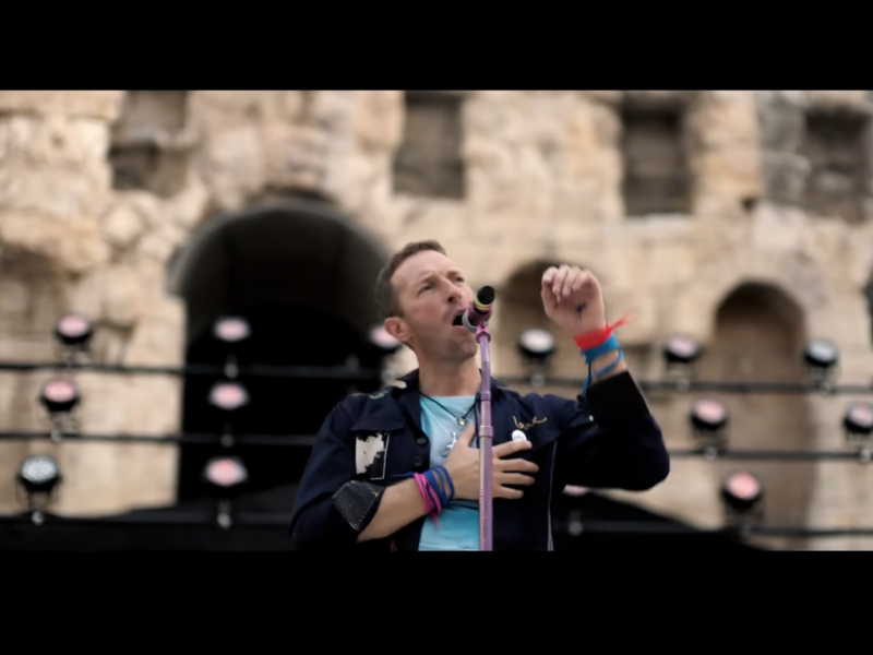Coldplay's Chris Martin singing onstage