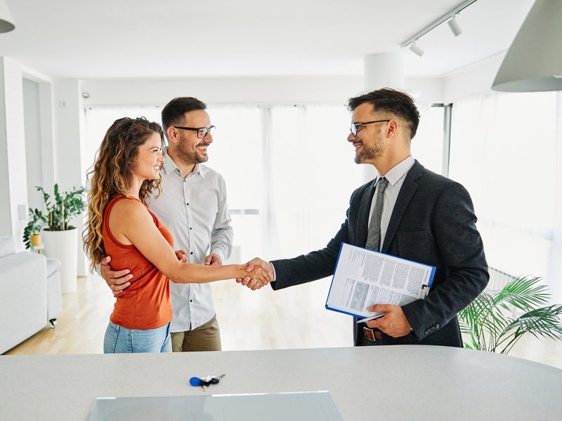 couple buying property with estate agent