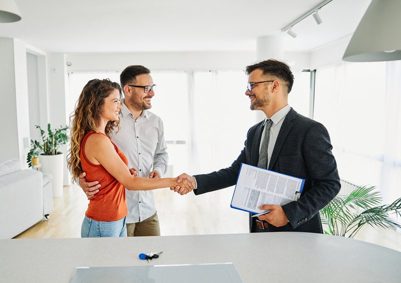 couple buying property with estate agent