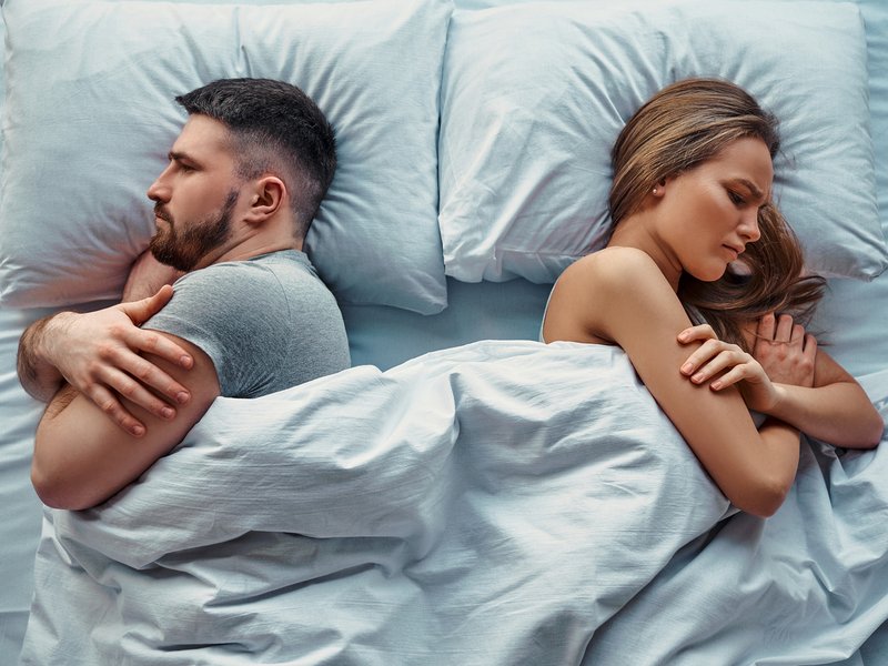Couple sleeping in bed