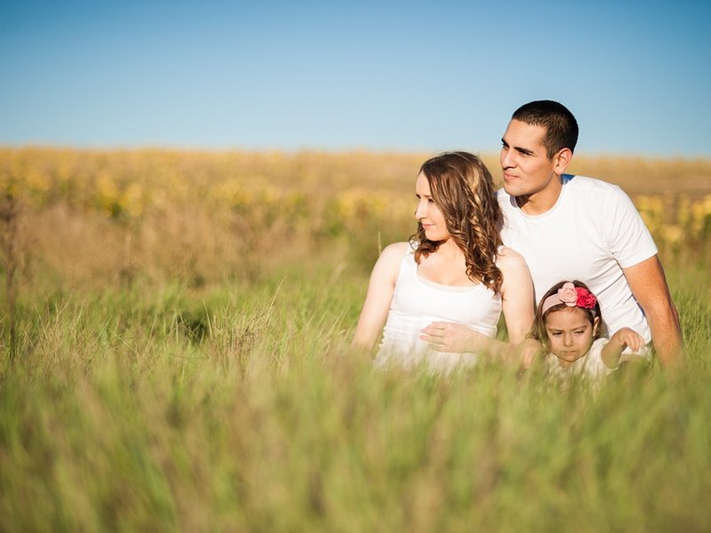 parents sitting with daughter