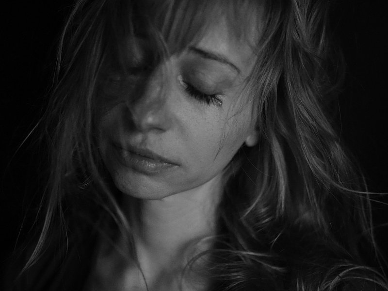 A black and white picture of woman crying