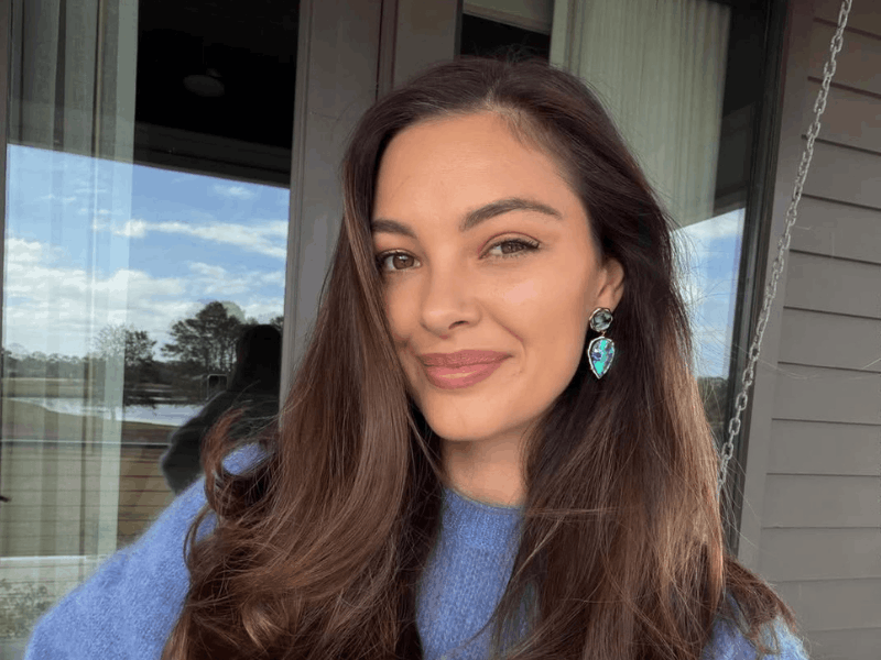 Demi-Leigh Tebow takes an outdoor selfie in a blue jersey