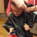 Boy crying over haircut