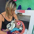 Baby savers rescuing a baby from a baby box