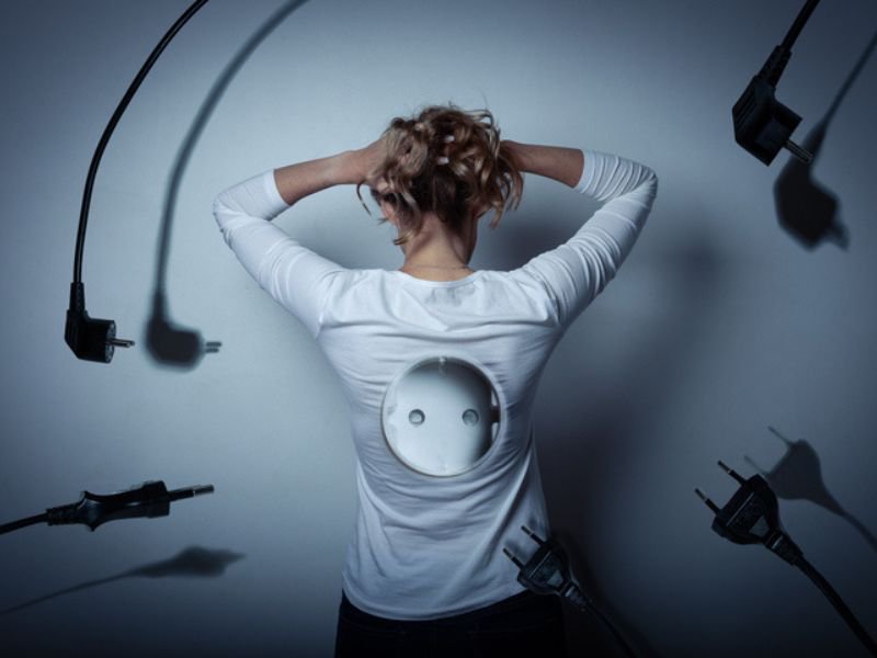 Woman with electrical plugs