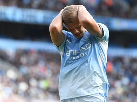 Manchester City striker Erling Haaland head in hands