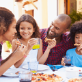 Family eating pizza at a restaurant