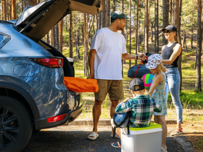 family with kids go camping