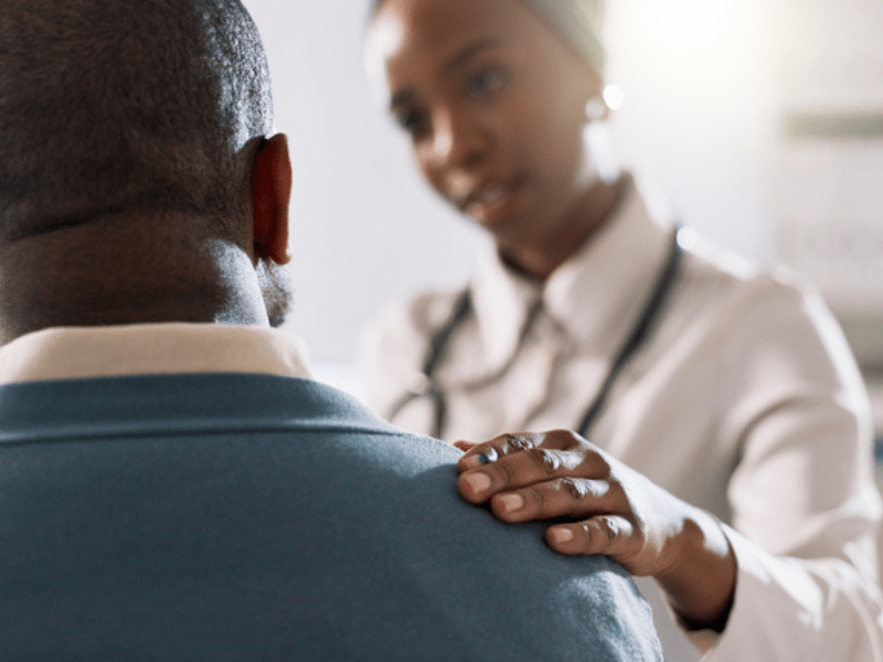 female doctor consults with a male patient