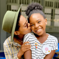 Gail Mabalane kisses her daughter Zoe on the cheek