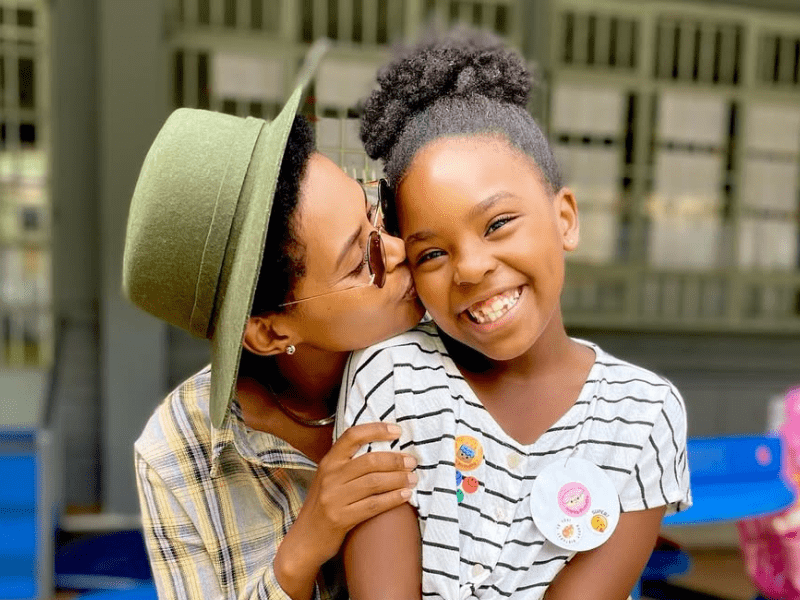 Gail Mabalane kisses her daughter Zoe on the cheek