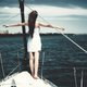 woman in titanic pose on boat