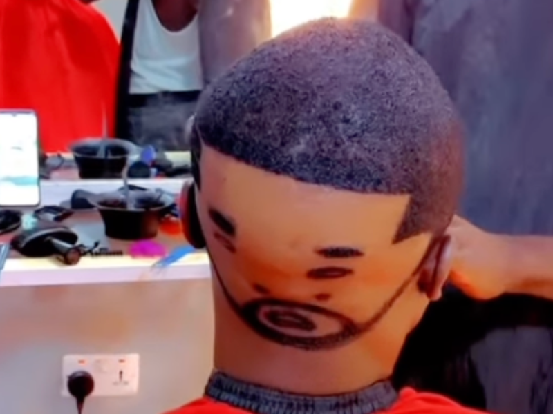Unusual haircut of face on a man's head