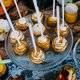 Sweet festive cake pops with golden glitter.