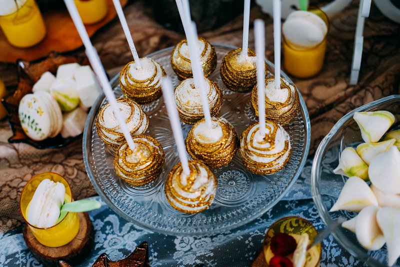 Sweet festive cake pops with golden glitter.