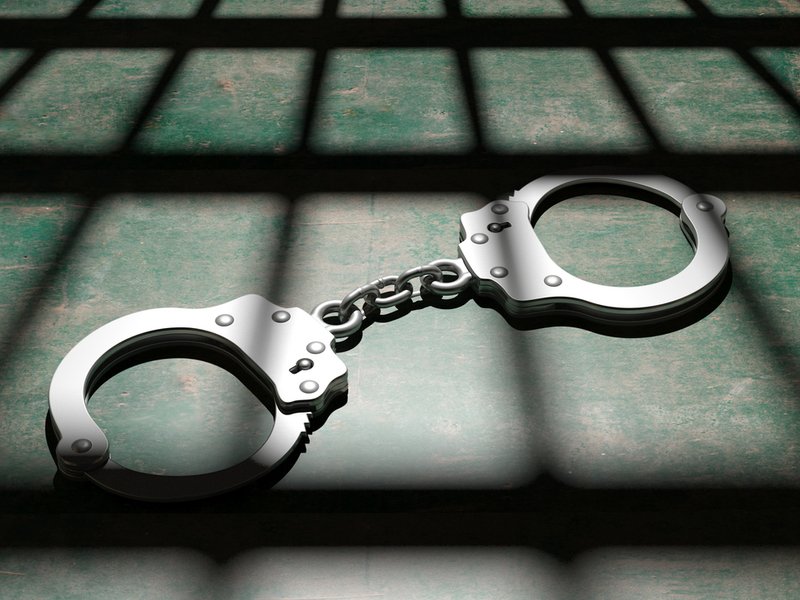 Jail bars and handcuffs generic