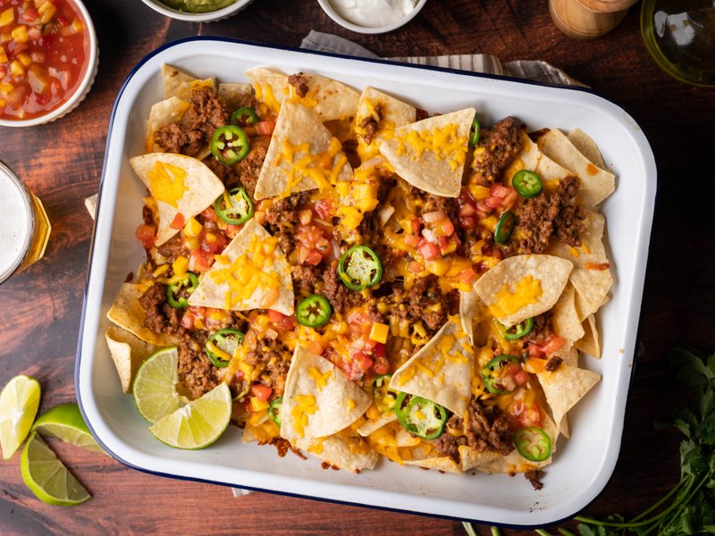 4-STAR hotel serves nachos to a guest on a rusty plate