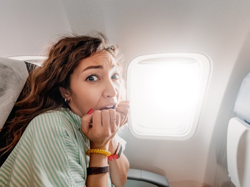 https://www.istockphoto.com/photo/woman-with-aerophobia-is-afraid-to-fly-on-an-airplane-and-experiences-a-panic-attack-gm1361309949-433824386?phrase=flying+fear