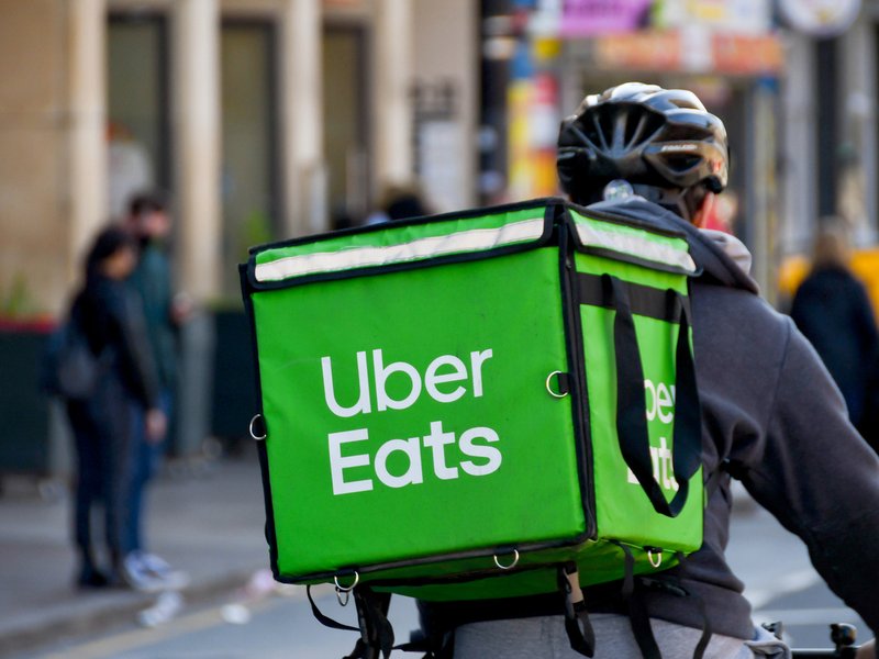 Uber Eats driver dancing on table