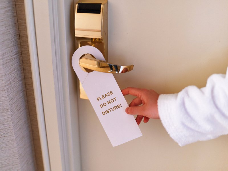 Do not disturb sign on hotel door leads to police checkup