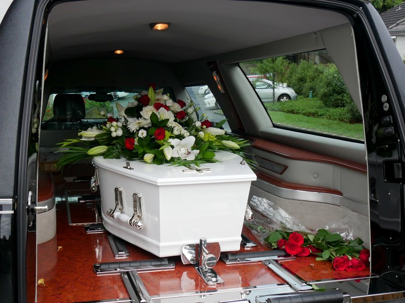 A colorful casket in a hearse or chapel before funeral or burial at cemetery / iStock