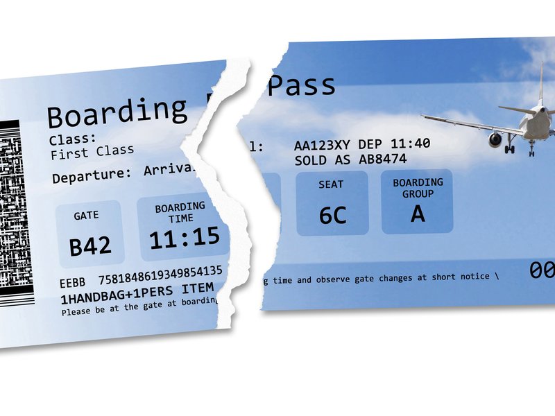 Flight cancelled concept image with ripped flight ticket - The image is totally invented and does not contain under copyright parts